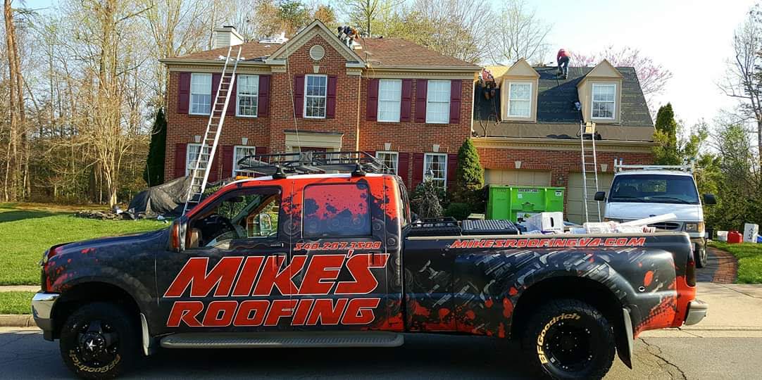 Completed roof replacement on a brick home by Mike's Roofing