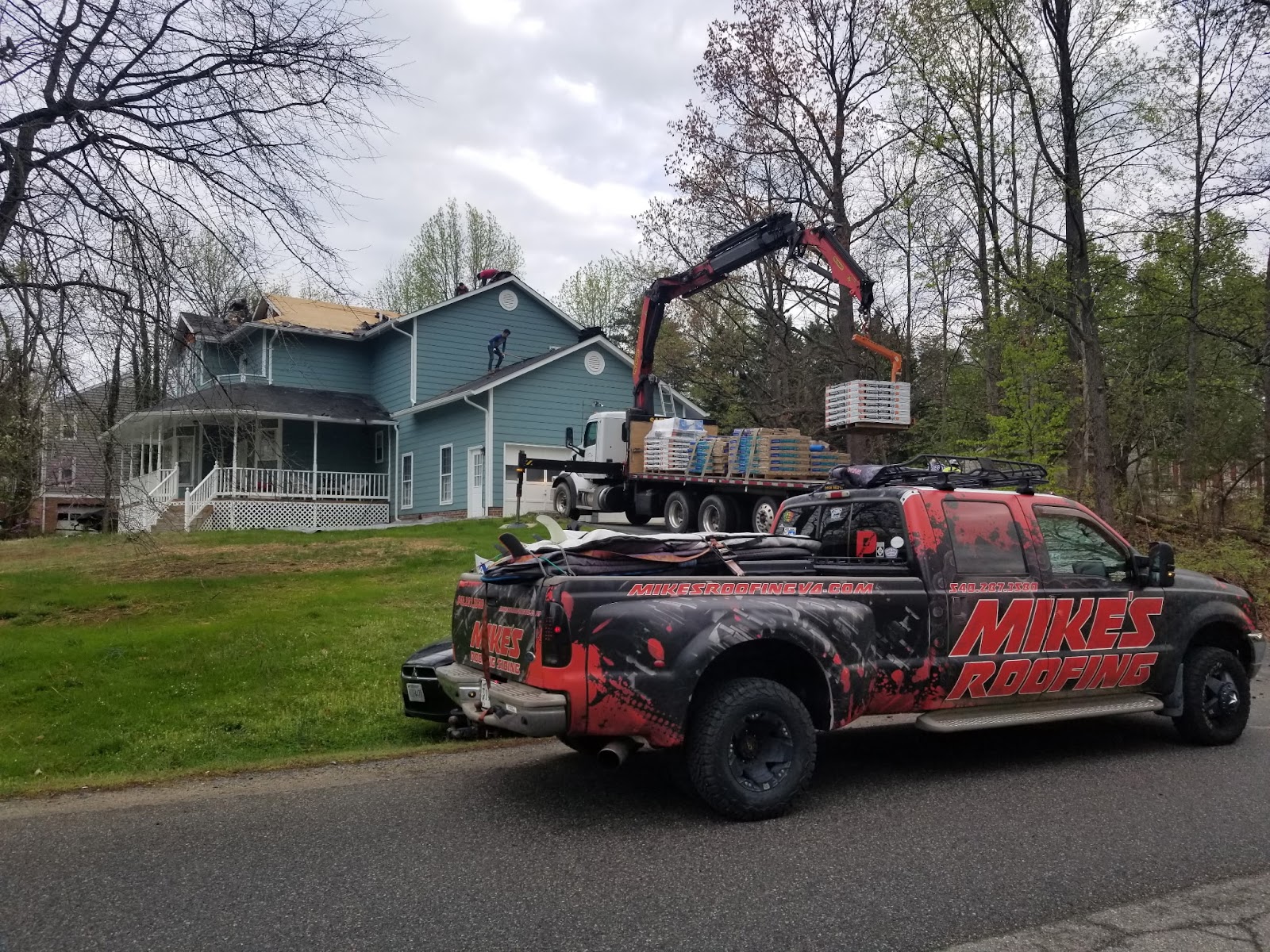 Mike's Roofing truck at a completed Virginia roofing project