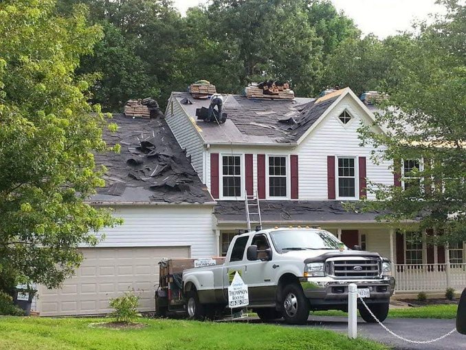 Before roof replacement with the old roofing system being removed